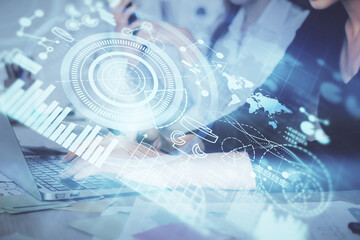 Multi exposure of woman hands typing on computer and business theme hologram drawing. Success concept.