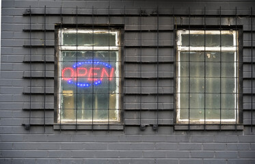 Illuminated red open sign on shop window