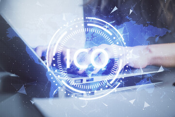 Double exposure of woman hands typing on computer and crypto market theme hologram drawing....