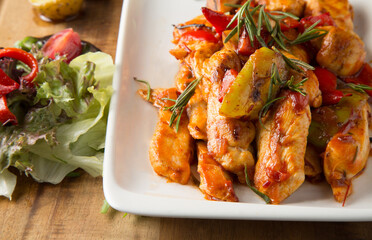 Grilled chicken with chili sauce and green salad