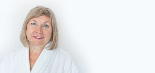 Portrait of a cute smiling senior woman Anti-aging concept. Mature woman's face after spa...