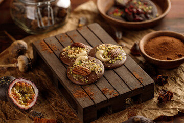 Handmade dark chocolate on a wooden plate