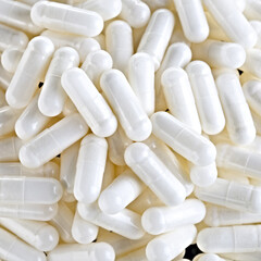 Herbal medicine capsule for the treatment of virus and diseases. Photographed close-up on a black background.