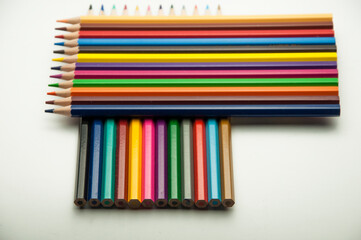 colored pencils on a white background. education concept. illustration of training.