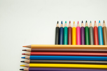 colored pencils on a white background. education concept. illustration of training.