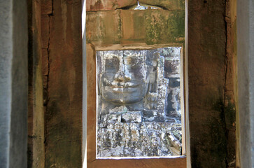 Face through the windows of the Bayon Temple, Cambodia 