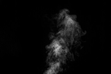 Curly white steam rising up isolated on a black background. Fog backdrop for your photos.