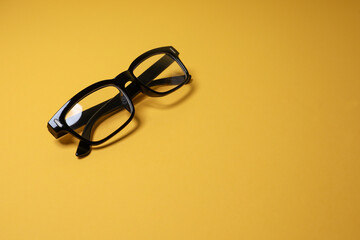 Eyeglasses isolated on the yellow background 