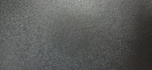 Obraz premium Black rough surface with highlights 