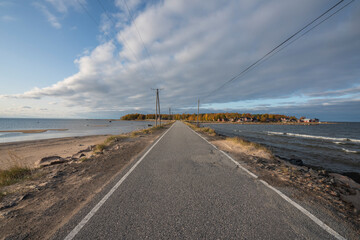 Fototapeta premium Road to an island with high altitude clouds.