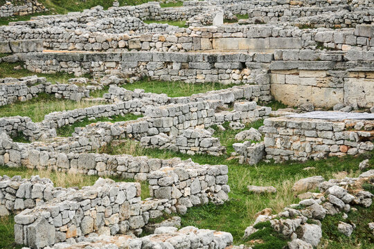 labyrinth of remains of ancient walls on the site of a destroyed antique city