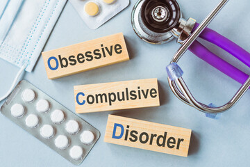 Obsessive Compulsive Disorder words on wooden blocks. Medical concept