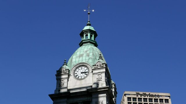 Modern clock and The Province building in downtown Vancouver BC Canada with 4k resolution