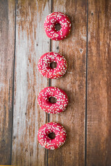 Donuts on wooden background. Food concept. American junk food