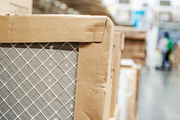 Ceramic tiles in a cardboard box. Trade in flooring in a specialized store. Close-up