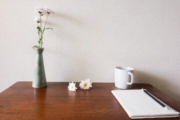 Cropped shot view of wood office desk table with the office equipments, and other office supplies on the modern space, flat lay.