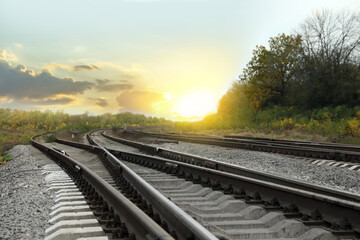 Fototapeta na wymiar Railway lines with track ballast in countryside. Train journey