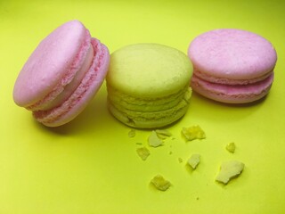 Colorful macaroni cookies, macaroni cake or on a yellow background