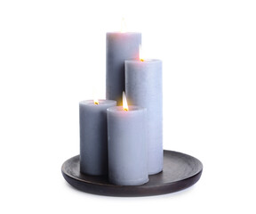 Glowing candles on white background