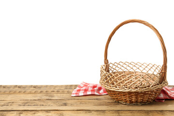 Fototapeta na wymiar Wicker basket and towel on wooden table against white background, space for text. Easter item