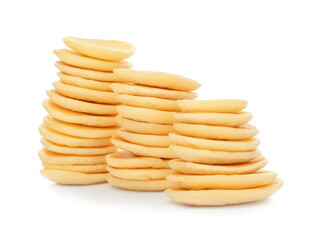 Stacks of tasty pancakes on white background