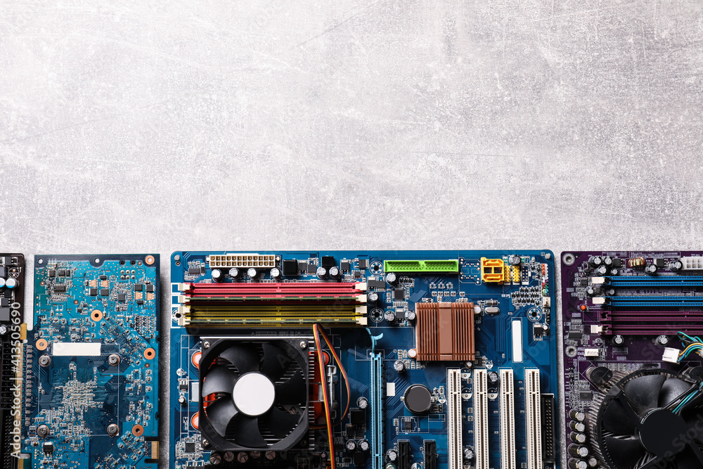 Poster computer motherboards on light grey table, flat lay with space for text. electronic device