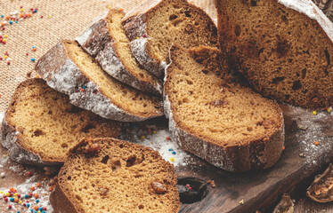 Delicious sweet bread roll on wooden background