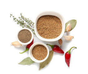 Bowls with different spices on white background