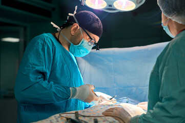 surgeon performs the operation in the operating room