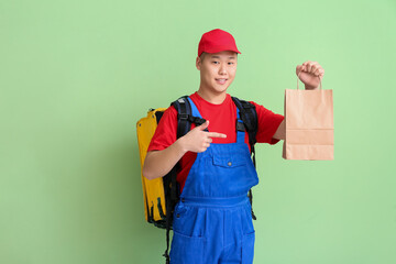 Courier of food delivery service on color background