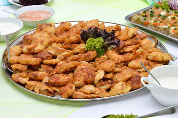 Chicken nuggets on a white plate