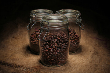 variety of roasted arabica and robusta coffee beans from Indonesia, kept in a tight sealed glass jar