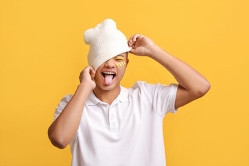 Creative portrait of handsome young man on color background