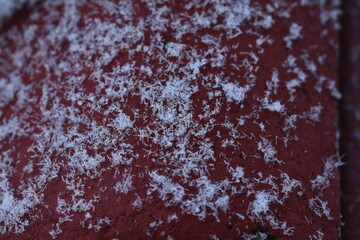 Snow flakes on red tile