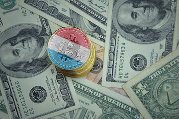 golden shining bitcoins with flag of luxembourg on a dollar money background.