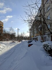 the car is covered with snow due to heavy snowfall. bad weather and lots of snow