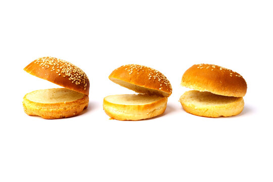 Three Cut Sesame Buns For A Hamburger Isolated On A White