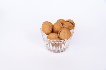 Walnuts in a shell on a white background. Healthy nuts.