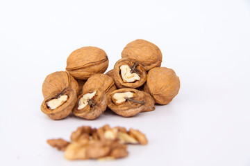 Walnuts in a shell on a white background. Healthy nuts.