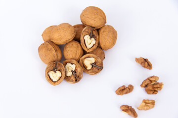 Walnuts in a shell on a white background. Healthy nuts.