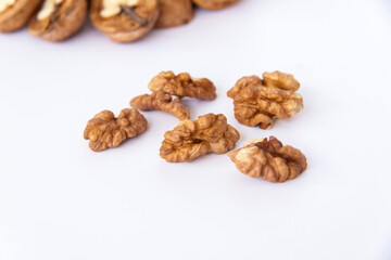 Walnuts in a shell on a white background. Healthy nuts.