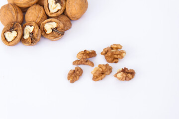 Walnuts in a shell on a white background. Healthy nuts.