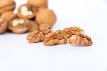 Walnuts in a shell on a white background. Healthy nuts.
