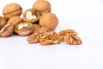 Walnuts in a shell on a white background. Healthy nuts.