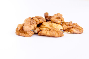 Walnuts without shells on a white background. Healthy nuts.