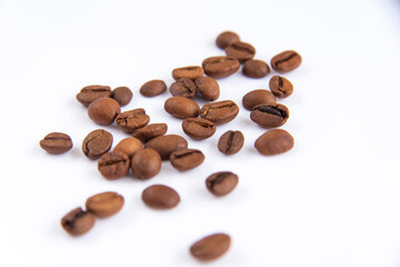 Coffee beans on a white background. Roasted coffee beans.
