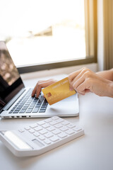 Young Asian consumer woman hand holding a credit card, Ready to spending pay online shopping...