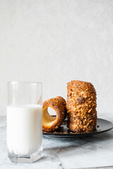 glass of milk and cookies with nuts and cinnamon