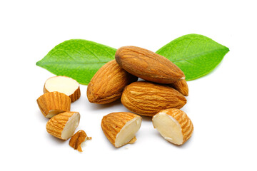 Close up of almonds with leaves, isolated on white background