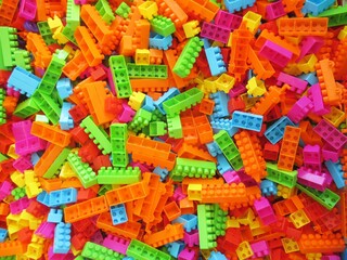 Fototapeta na wymiar Piled Colorful Toy Bricks